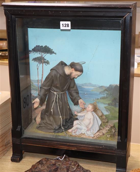 An early 20th century Italian religious diorama depicting Saint Francis and the infant Jesus before a painted seascape height 52cm appr